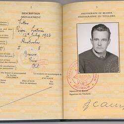 Open passport with off-white page. Black and white photo of man. Printed and handwritten text. Red stamp.