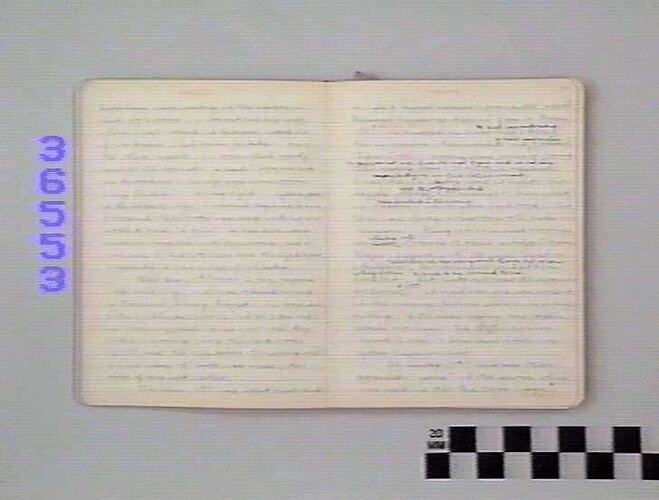 Open book page with handwritten text on off-white page.