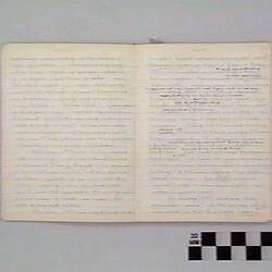 Open book page with handwritten text on off-white page.
