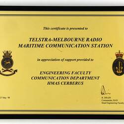 Framed Certificate - Presented to Telstra-Melbourne Radio Maritime Communication Station, by HMAS Cerberus, 27 May 1998