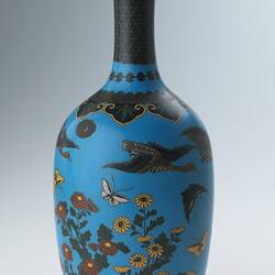 Blue vase with butterfly, bird and flowers