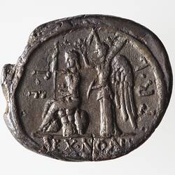 Round coin, aged, seated figure holding sceptre, winged figure behind, holding wreath and palm branch.