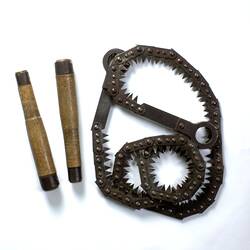 Metal folding saw, two wood handles.