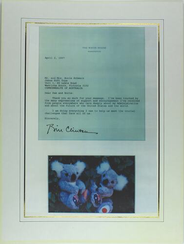 Printed letter on blue sheet with picture of two fluffy toys below.
