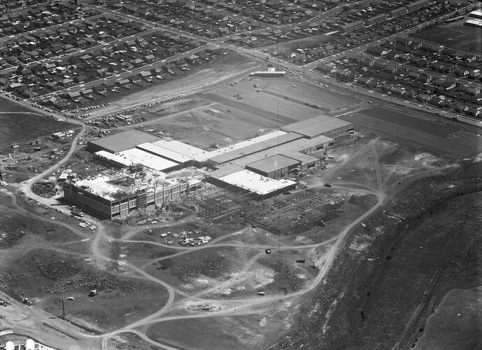 Monochrome aerial image of a construction site.