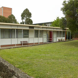 Single storey building with lawn in front.