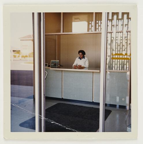 Slide 341, 'Extra Prints of Coburg Lecture', Worker At Customer Service Counter, Building 20, Kodak Factory, Coburg, circa 1960s