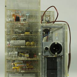 Control box, partially in clear box that shows internal wiring and components.