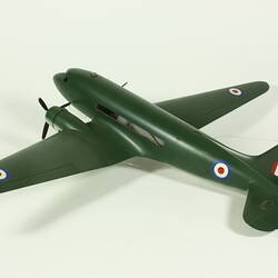 Dark green two propeller aeroplane model with painted red, white, blue flag and roundels.