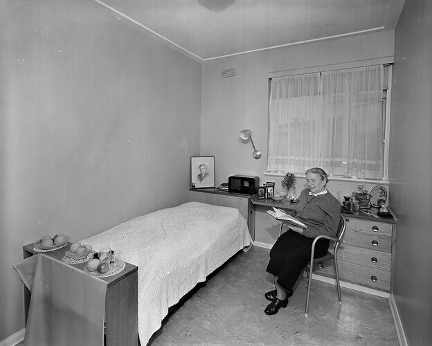 Australian Jewish Welfare & Relief Society, Woman Reading in a Bedroom, South Yarra, Victoria, Nov 1958