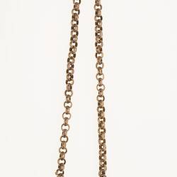 Silver watch chain with silver sovereign case and miniature book.