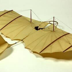 Model of off-white glider. Three quarter back right view.