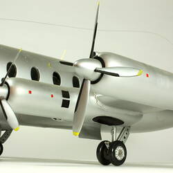 Silver model aeroplane. Fuselage and wing detail.