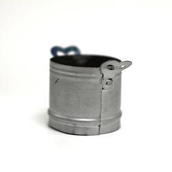 Toy silver pot.