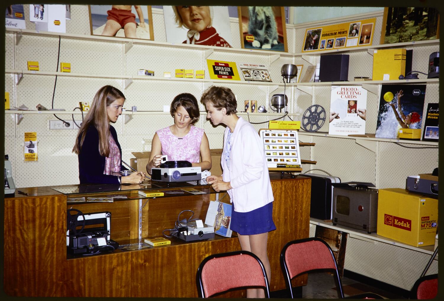 Slide Kodak Australasia Pty Ltd, Women with Slide Projector in Shop
