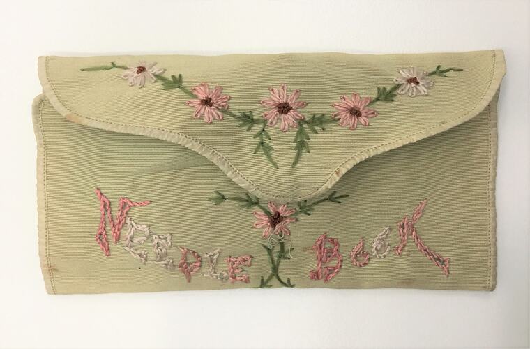 Embroidered needle book, folded.