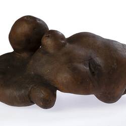 Irregularly shaped brown model of a potato.