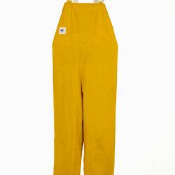 Yellow waterproof dungarees with white shoulder straps.