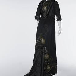 Black, silk satin dress, beading, floral embroidery. Back view.