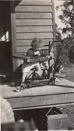 Digital Photograph - Girl in High-Chair, in Backyard, Boronia, 1934