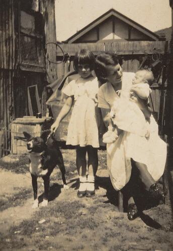 Digital Photograph - Woman with Girl, Baby & Dog, Backyard, Brunswick 1935