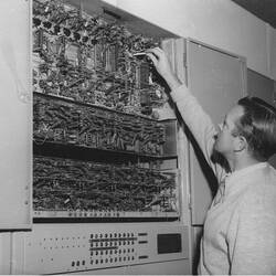 Photograph - CSIRAC Computer, Ron Bowles Adjusting Main Clock, 15 June 1956
