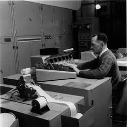 Photograph - CSIRAC Computer, Roy Muncey at Console with 12 Hole Tape Reader, 1960