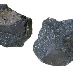 Two meteorite specimens.