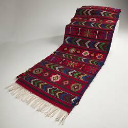 colorful cultural fringed rug