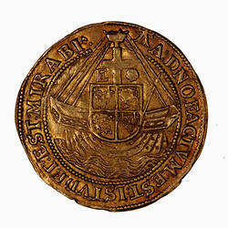 Coin, round, at centre a ship at sea with cross as mast surmounted by top-castle, the cross divides letter E.