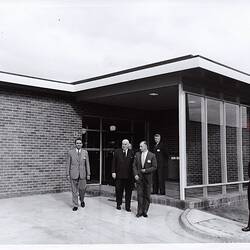 Photograph - Kodak Australasia Pty Ltd, Prime Minister Robert Menzies & Kodak Executives Exiting a Building at the Official Opening of the Kodak Factory, Coburg, 1961