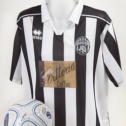 Black and white soccer jersey with soccer ball.