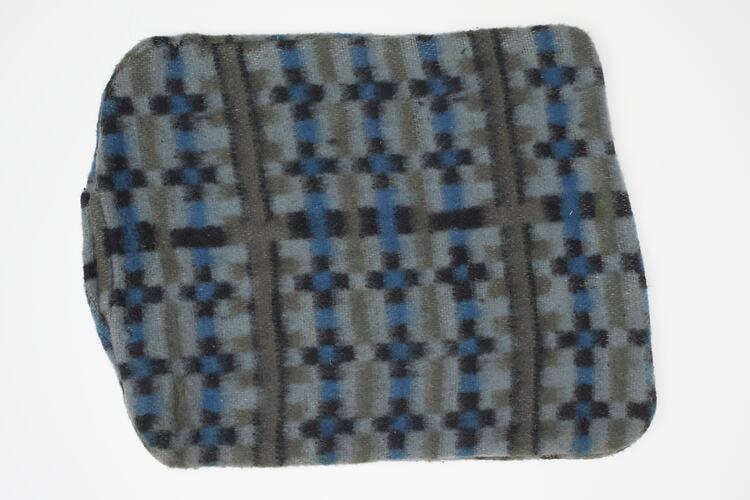 Hot water bottle cover with blue tartan pattern.