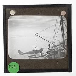 Lantern Slide - Gipsy Moth DH60X on the Lifting Hook, Ross Sea, Ellsworth Relief Expedition, Antarctica, 12 Jan 1936
