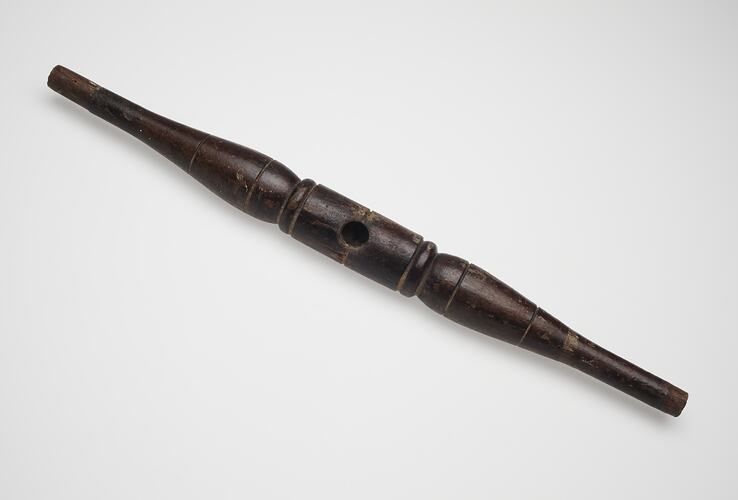Turned wooden furniture spindle.