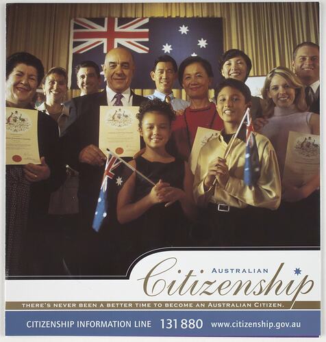 Smiling group with Australian flag behind them. Some hold certificates and others flags. Text below.