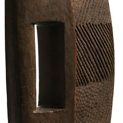 Wooden, wedge-shaped shield.