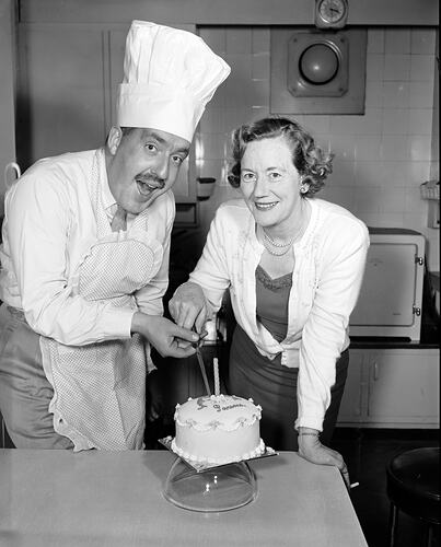 Bob Dyer and Woman Cutting a Birthday Cake, Melbourne, Victoria, Jul 1958