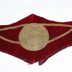 Child's wide scalloped edged red velvet belt (folded) with gold cord central circle and detail.
