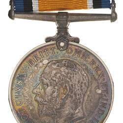 Round silver medal with profile of bearded man. Hangs from metal bar and blue, black, white, orange ribbon.