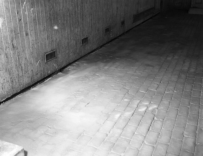 Monochrome photograph of a floor.