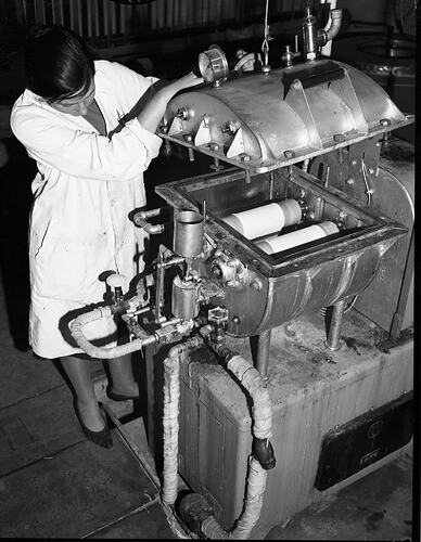 Monochrome photograph of a hoisery factory.