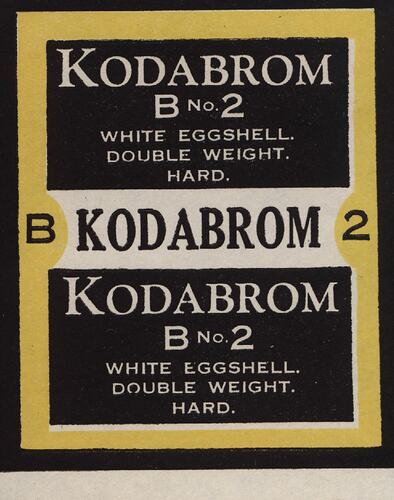 Black and white paper label with yellow border.