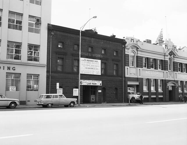 Monochrome image of a city car park.