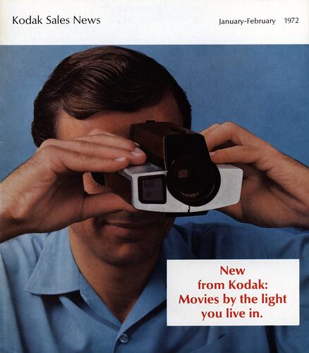 Magazine cover featuring photograph of man using camera.