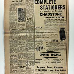 Front of newspaper with text and illustrated stationery advertisement