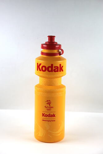 Yellow and red plastic pop-top drink bottle.