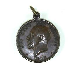 Medal reverse with head in profile motif.