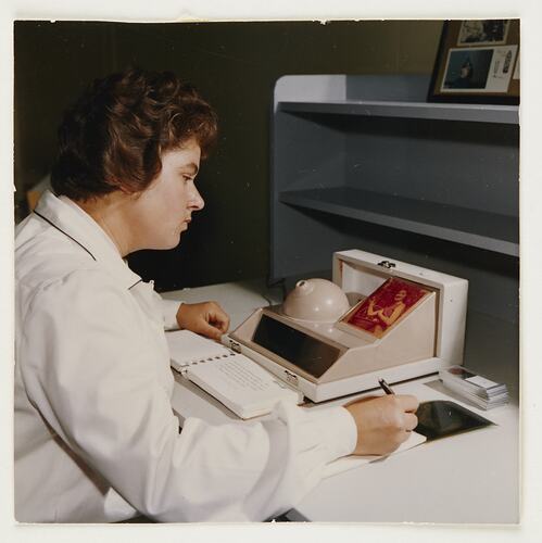 Trainee Reviewing Discoloured Print, Kodak Factory, Coburg, circa 1960s