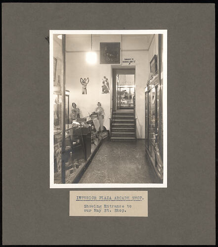 Black and white photograph of a shop interior.